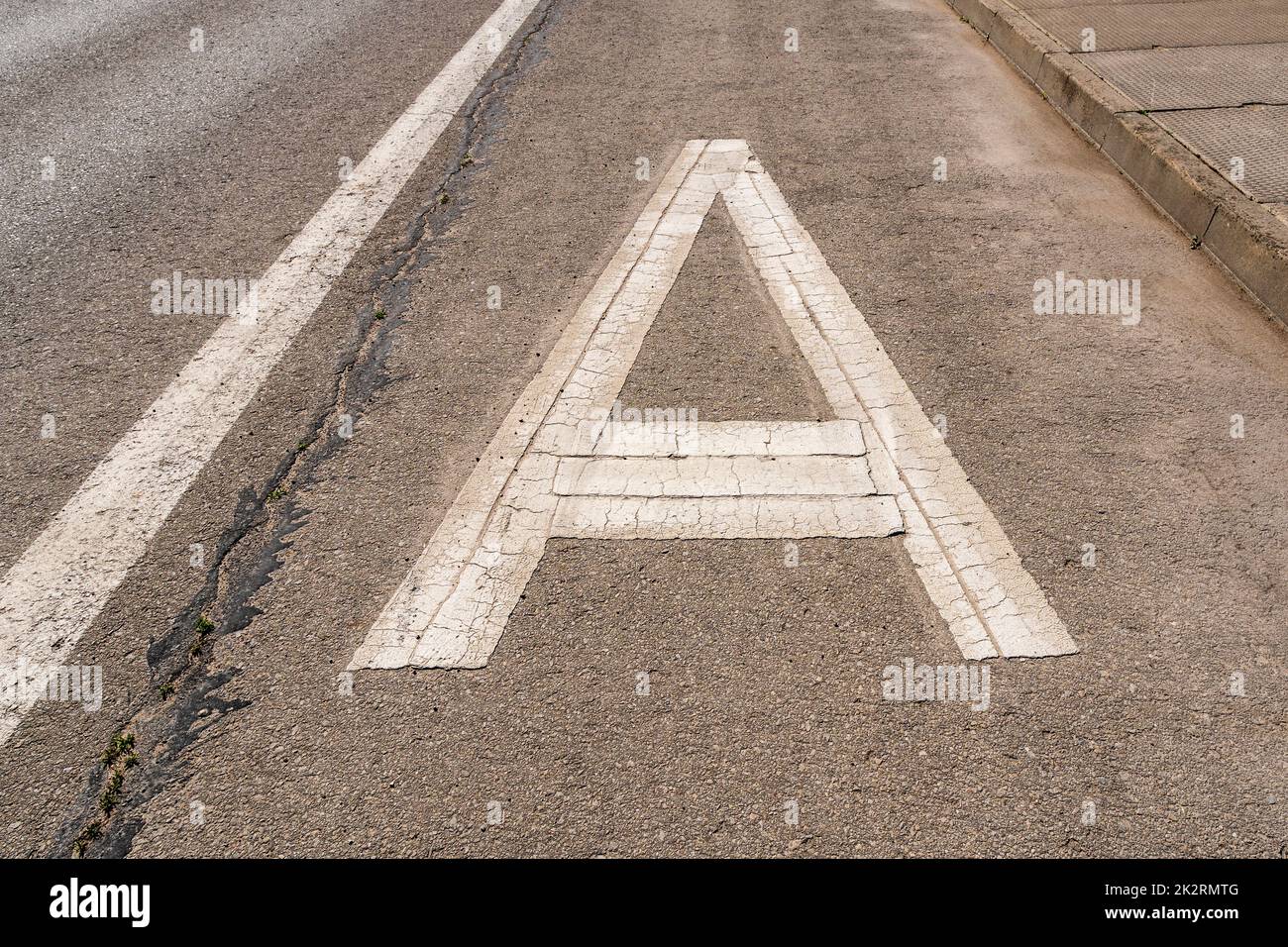 Asphalt road with white letter A Stock Photo