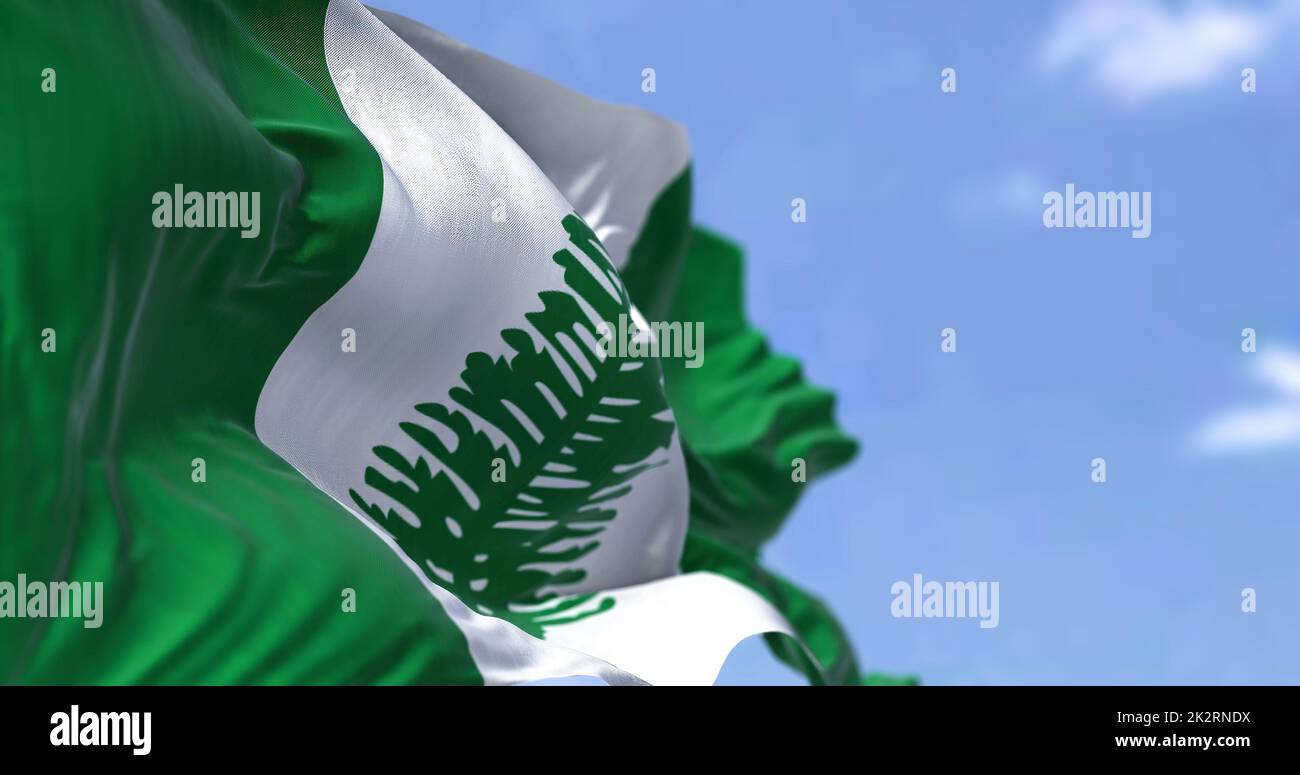 The flag of Norfolk Island waving in the wind on a clear day. Norfolk