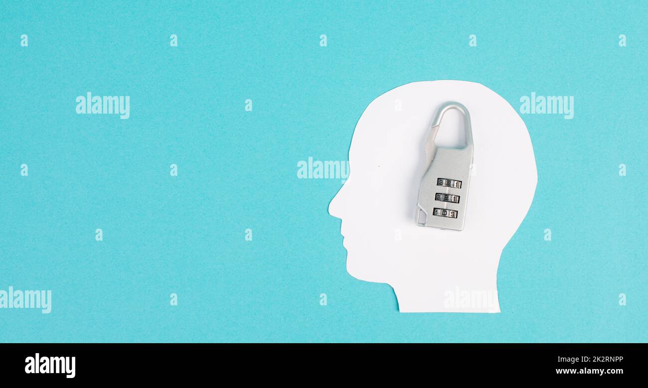 Silhouette of a head with a lock, lockout from computer cloud, safety concept, mental health, protection of thoughts and privacy Stock Photo