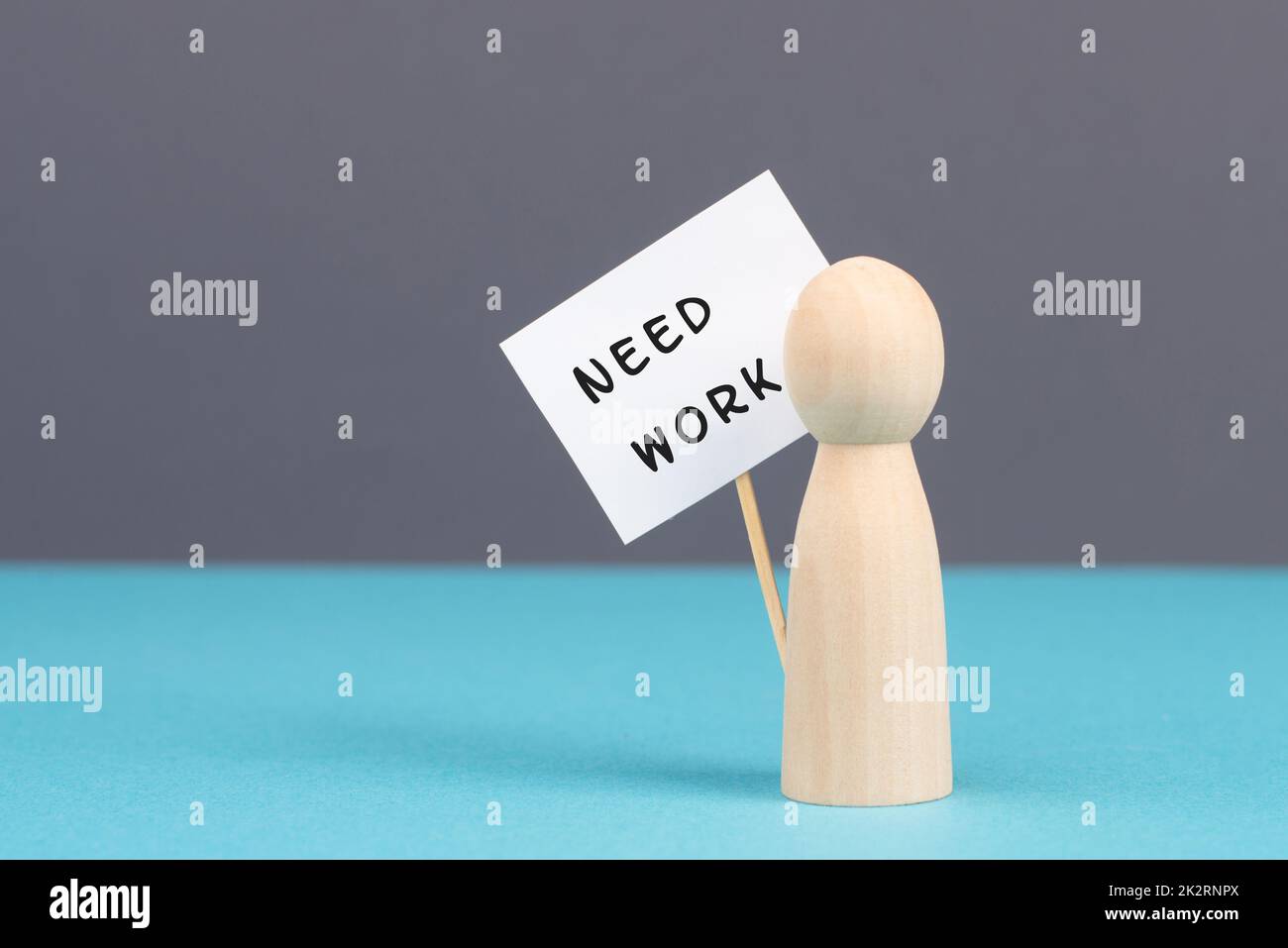 Man with a sign need work, unemployed is looking for a job, financial crisis, jobless people, social issue Stock Photo