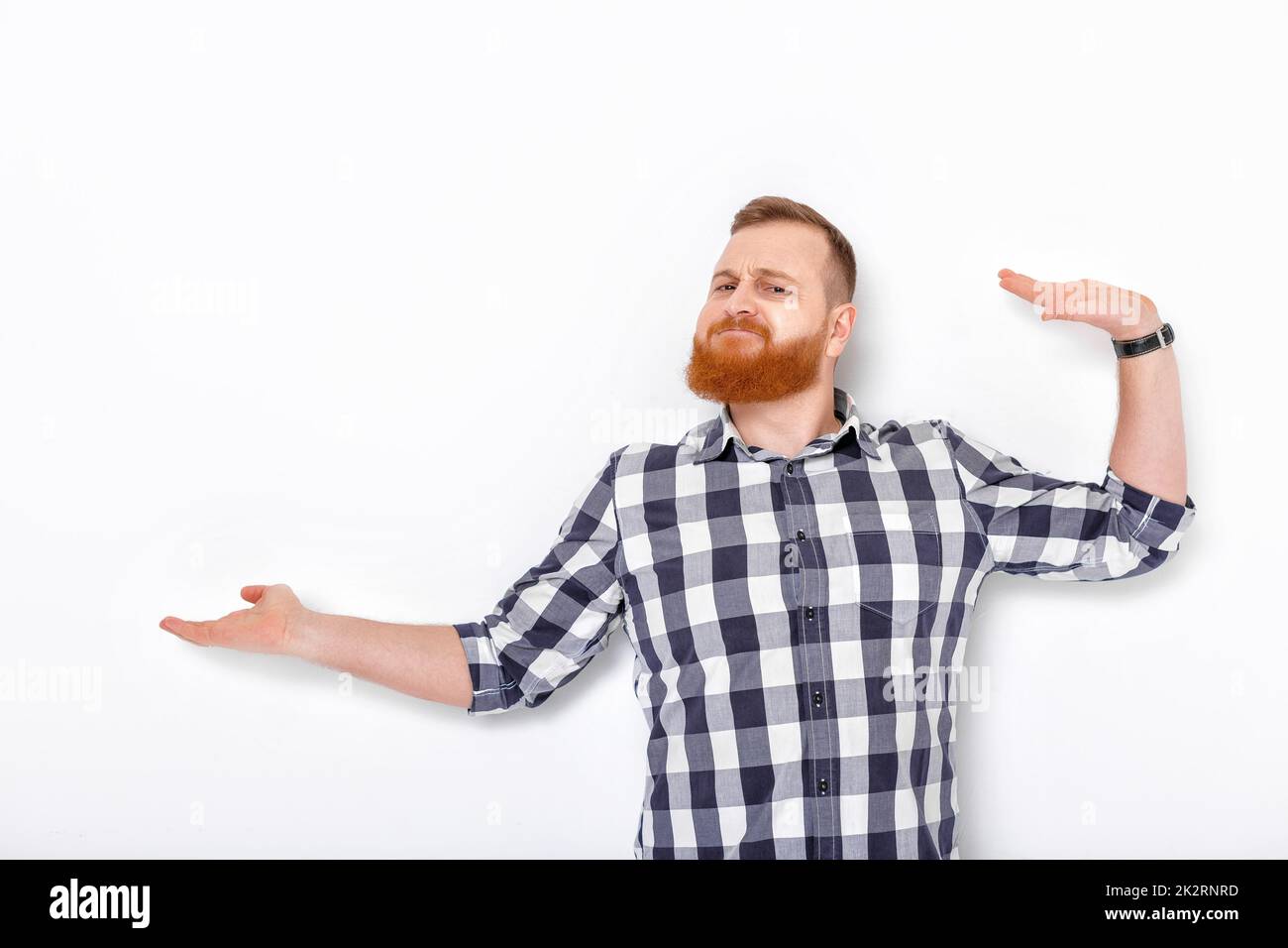 man with beard pointing copy space. Stock Photo