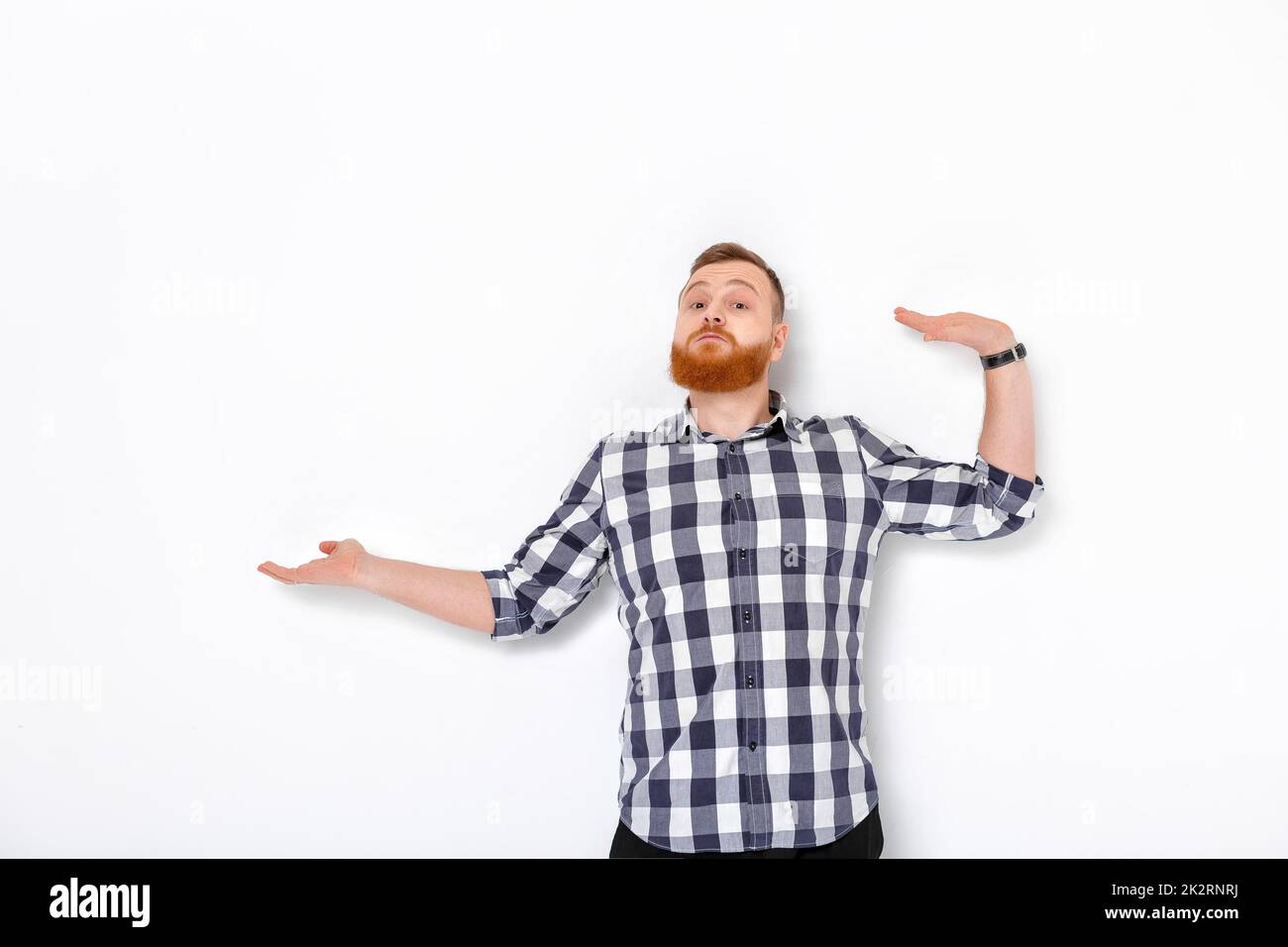 man with beard pointing copy space. Stock Photo