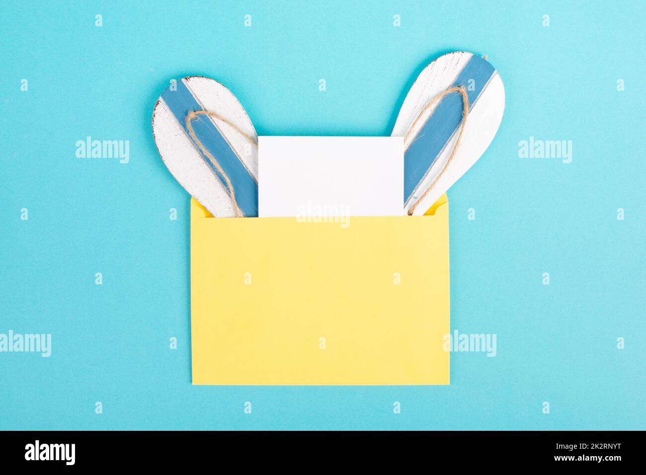 Blue colored summer and vacation background, flip flops in an envelope, copy space for text, holiday and tourism concept Stock Photo