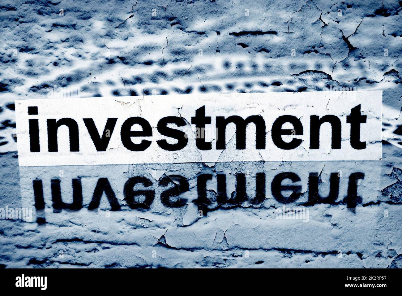 Investment text on grunge background Stock Photo