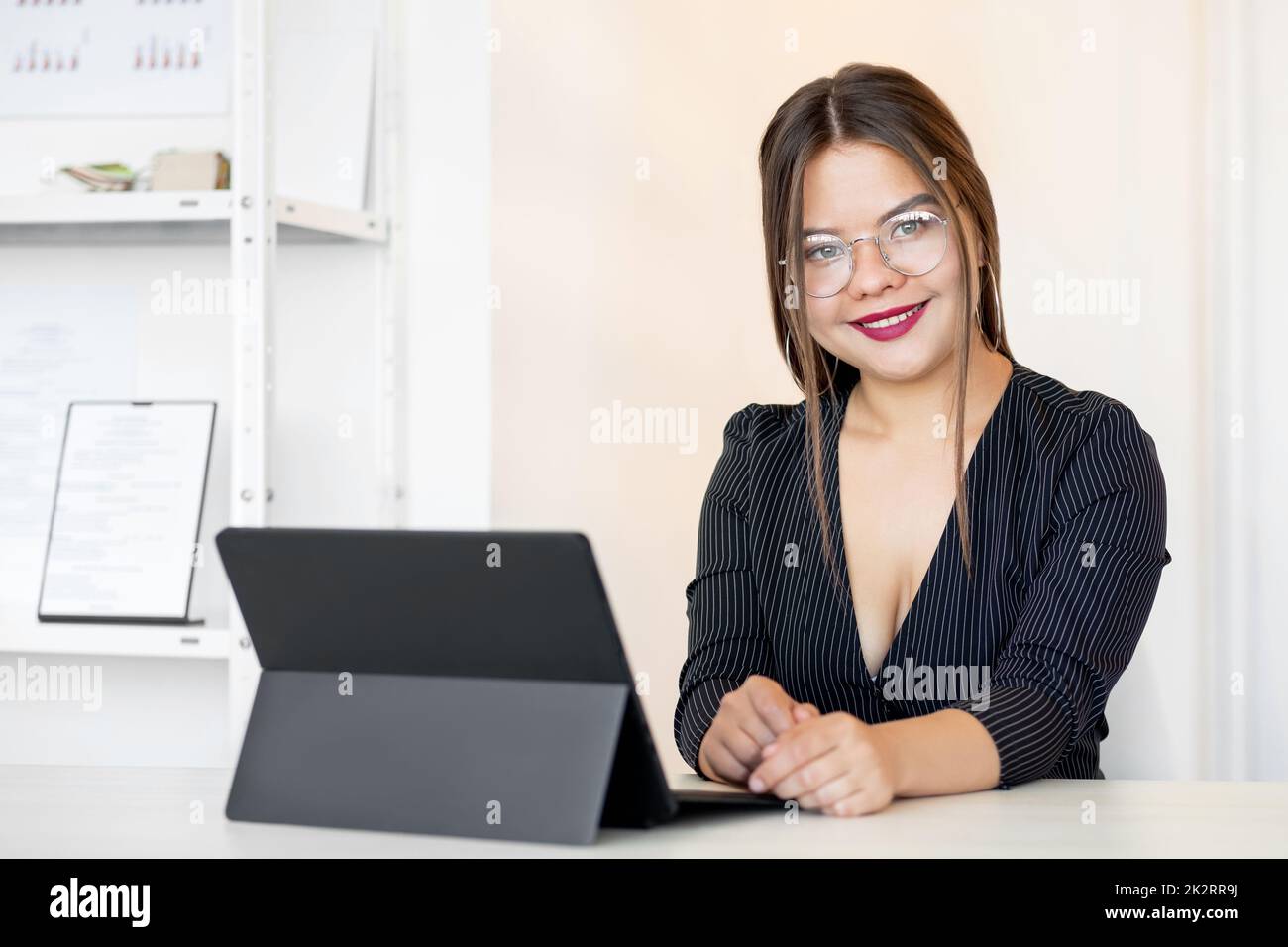 Successful business woman. Female leadership. Professional career. Confident ambitious smart lady in glasses working from home office with laptop. Stock Photo