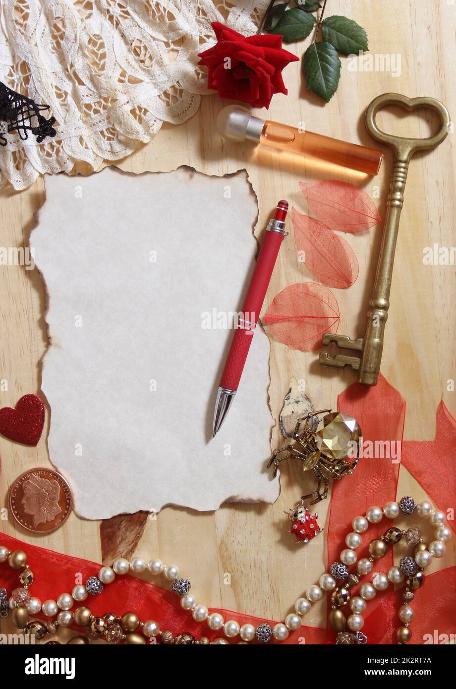 Vintage Jewelry and Lace With Antique Key on Wooden Background Stock Photo