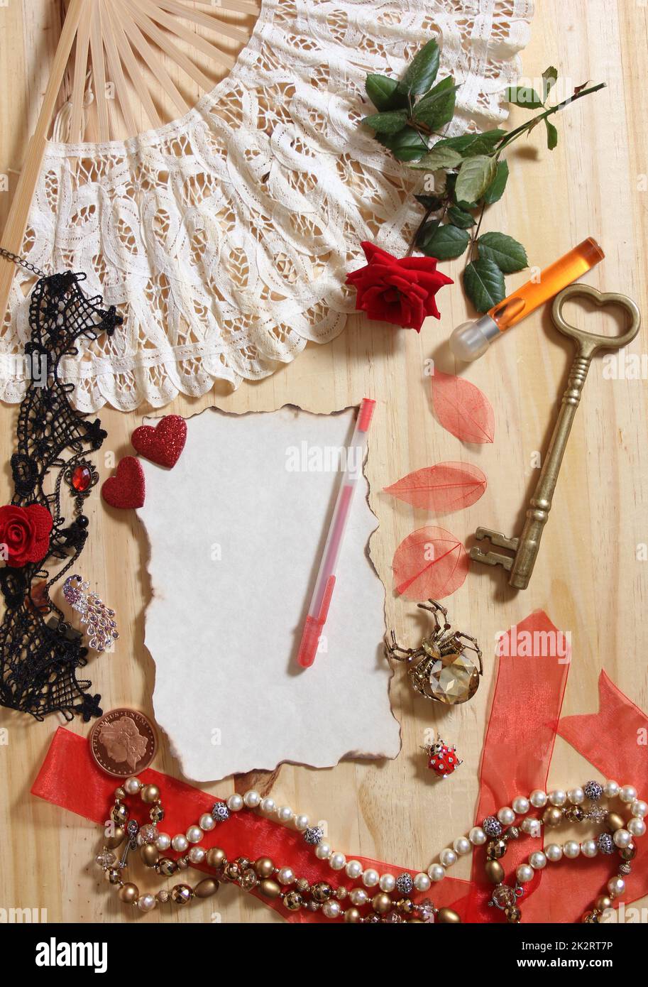 Vintage Jewelry and Lace With Antique Key on Wooden Background Stock Photo