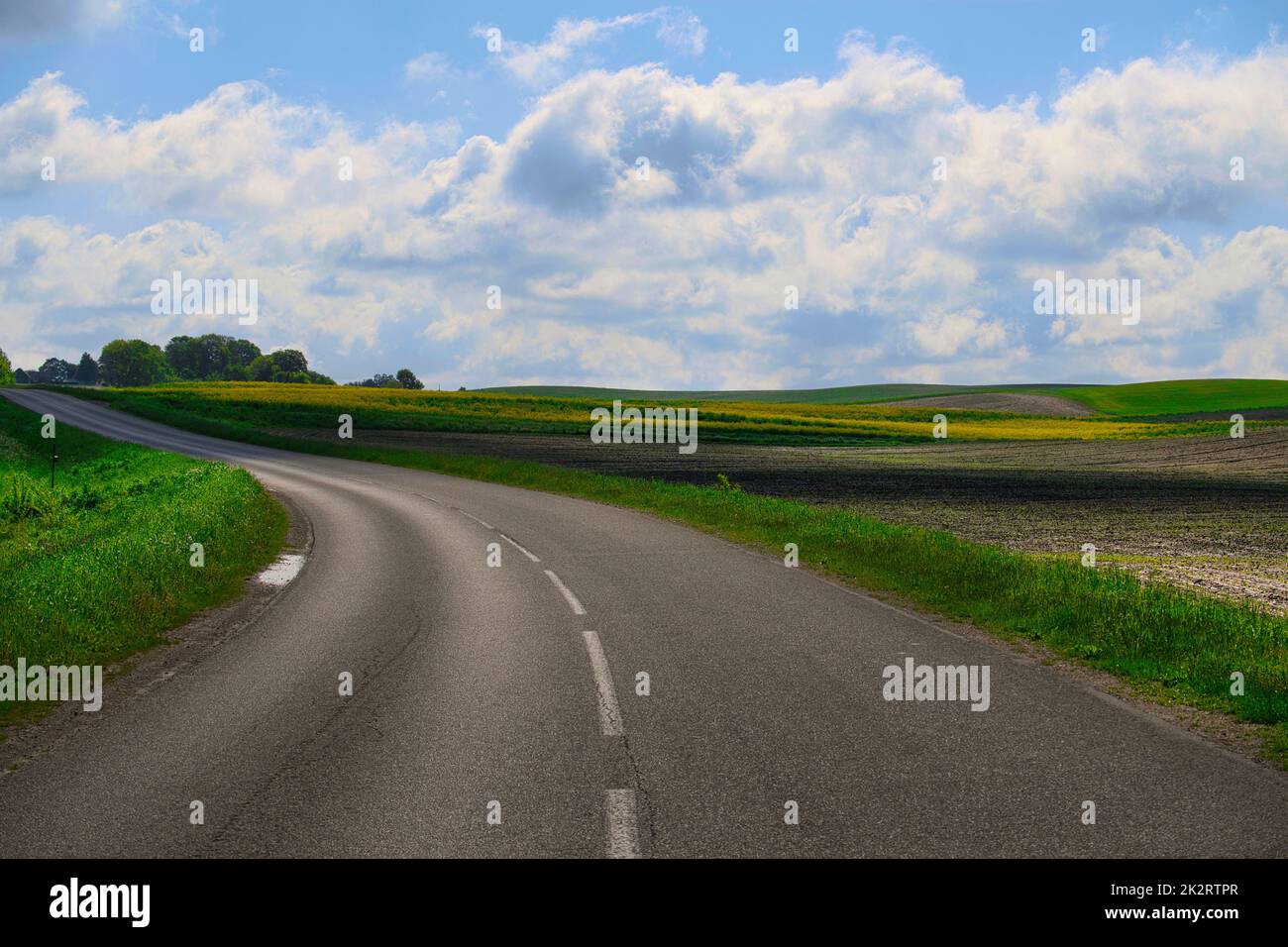 Road through picturesque countryside landscape Stock Photo