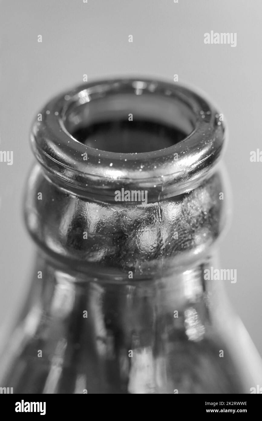 A close-up of a neck of a glass bottle for beverages. Stock Photo