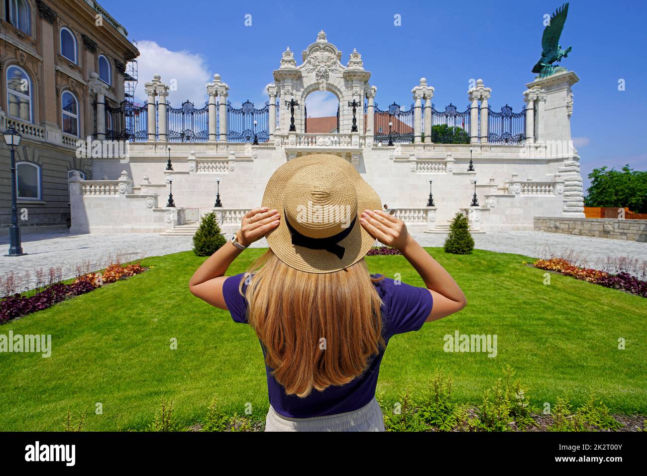 Tourism in Budapest. Back view of young tourist woman visiting Buda Castle in Budapest, Hungary, Europe. Stock Photo