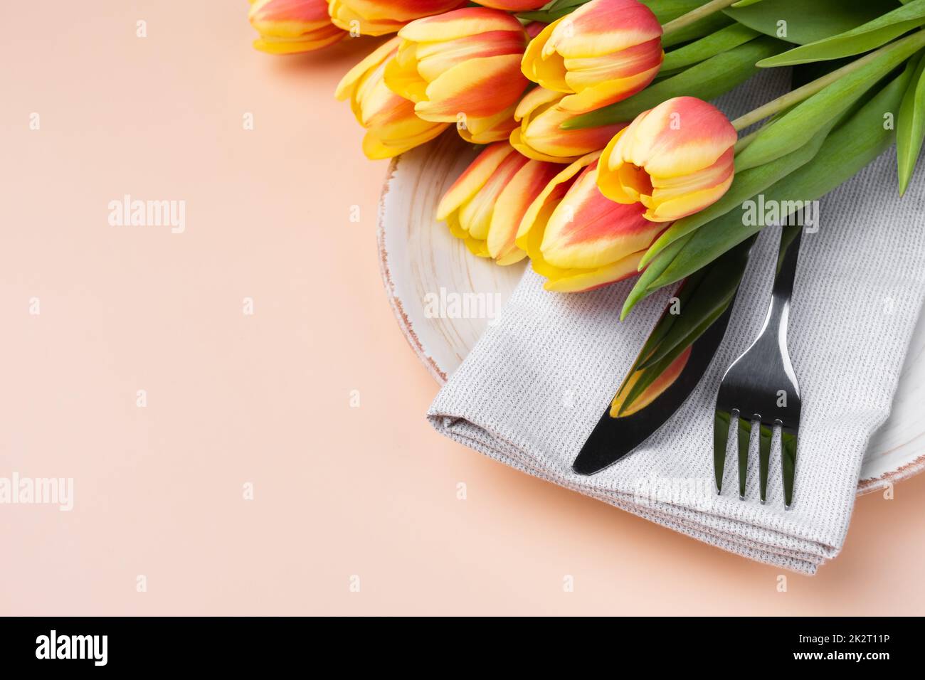 Elegantly holiday dinner table. Festive table setting at neutral beige color top view. Stock Photo