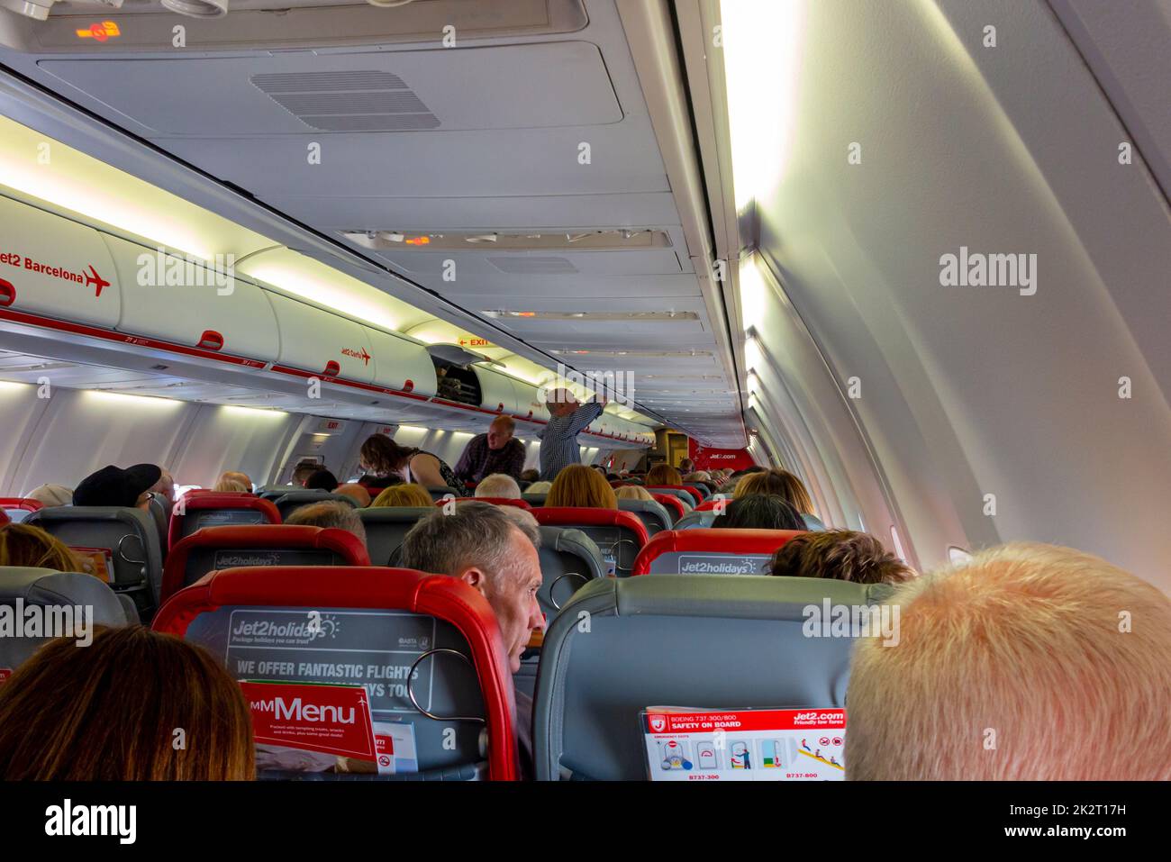 Passengers on board a Jet 2 Boeing 737 aircraft shortly after take off from Manchester Airport in northern England UK Stock Photo