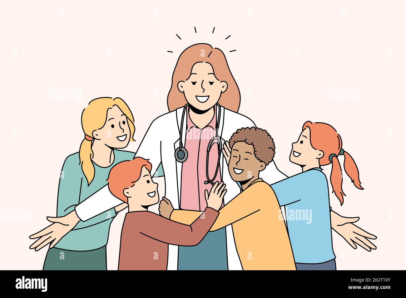 Smiling children hugging female pediatrician Stock Photo