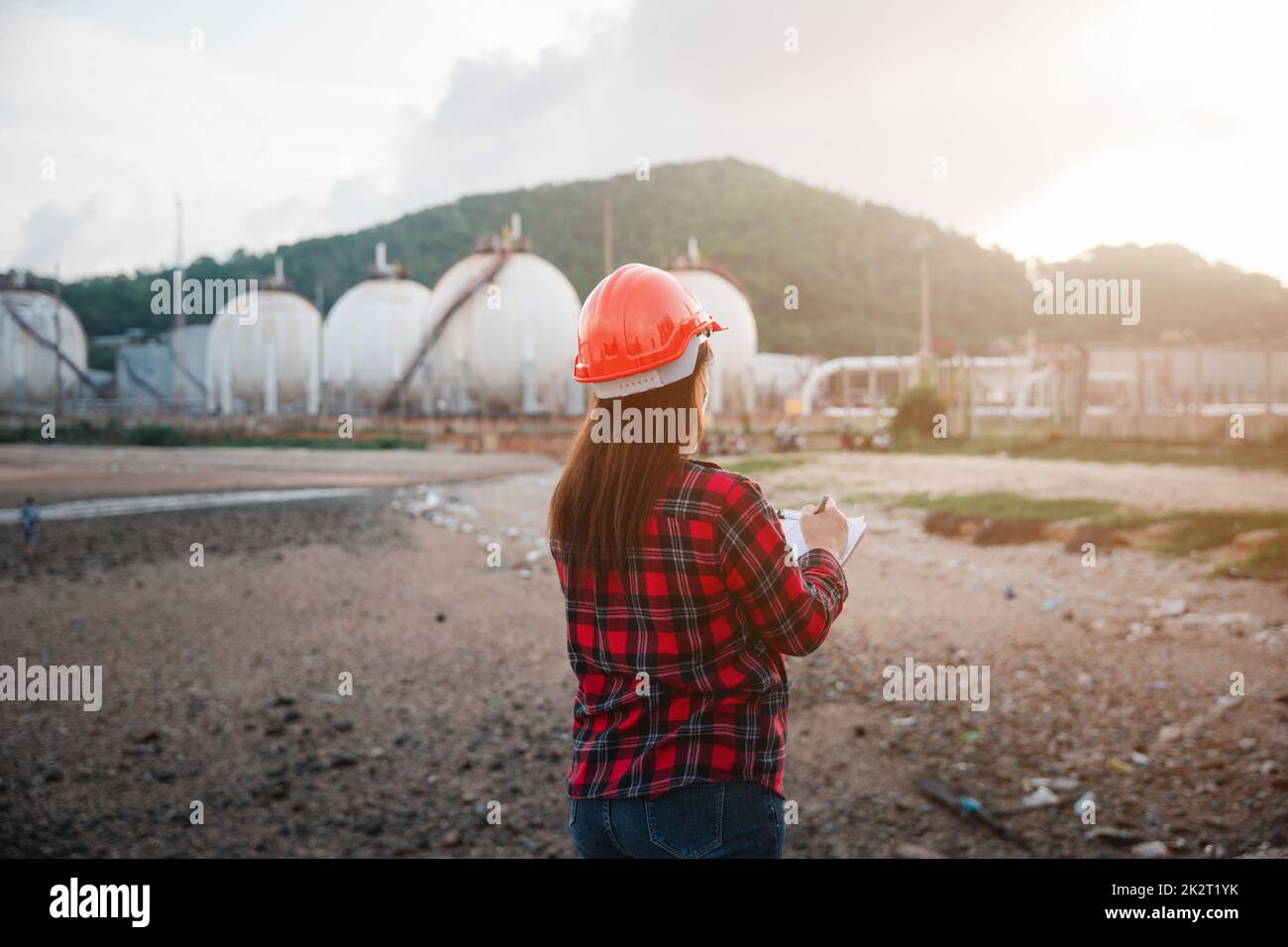 Petroleum Engineers. Happy Asian worker woman in oil chemical industry