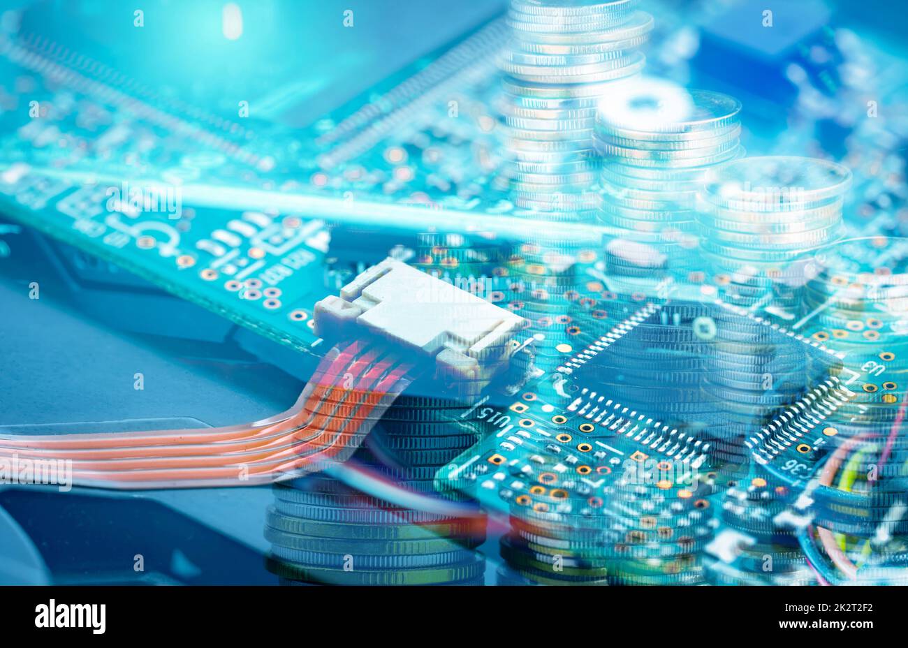 Electronic circuit board and coin stack. Mainboard of computer. Electronic business industry.  Computer integrated circuit board. Memory of digital information hardware. Electronic engineering tech. Stock Photo