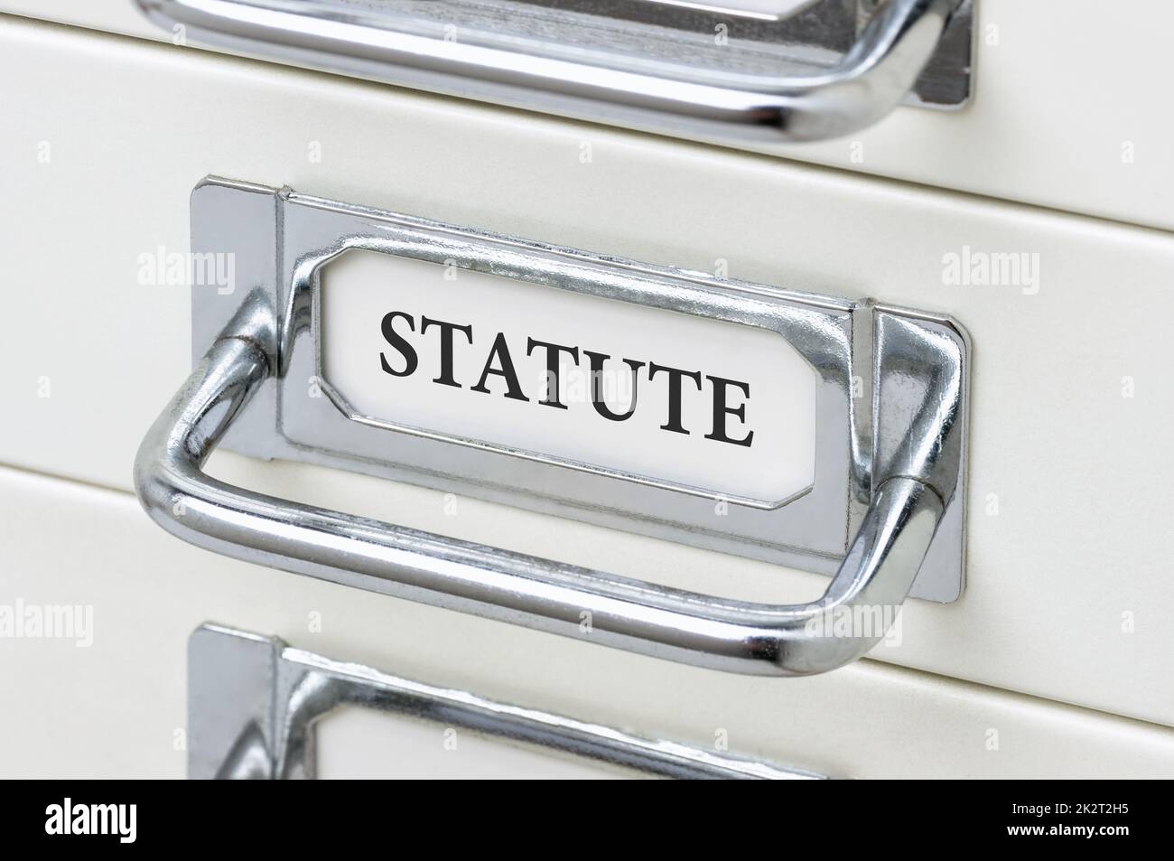 A drawer cabinet with the label Statute Stock Photo