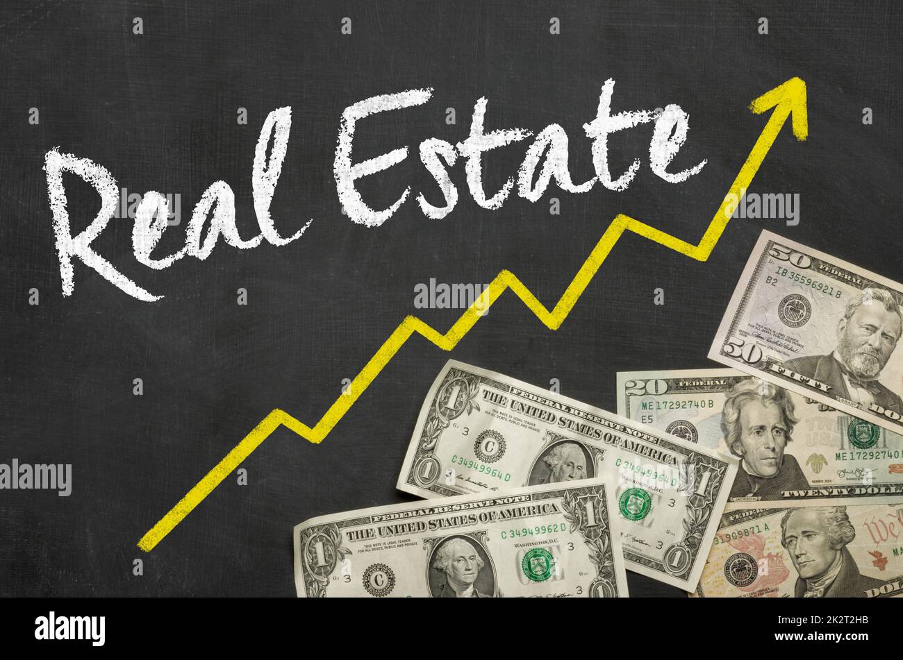 Text on blackboard with Dollars - Real Estate Stock Photo