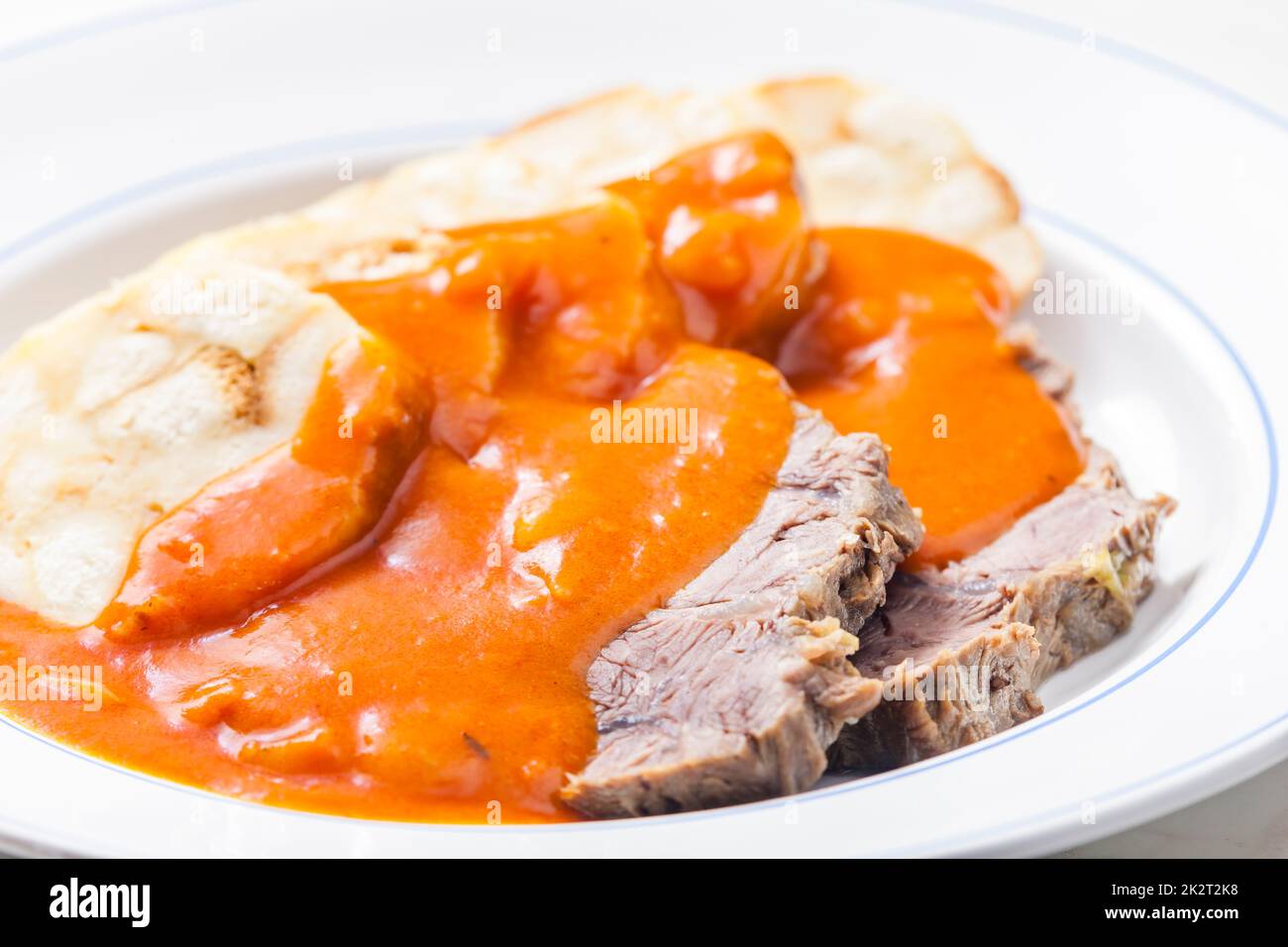 beef meat with tomato sauce with dumplings Stock Photo