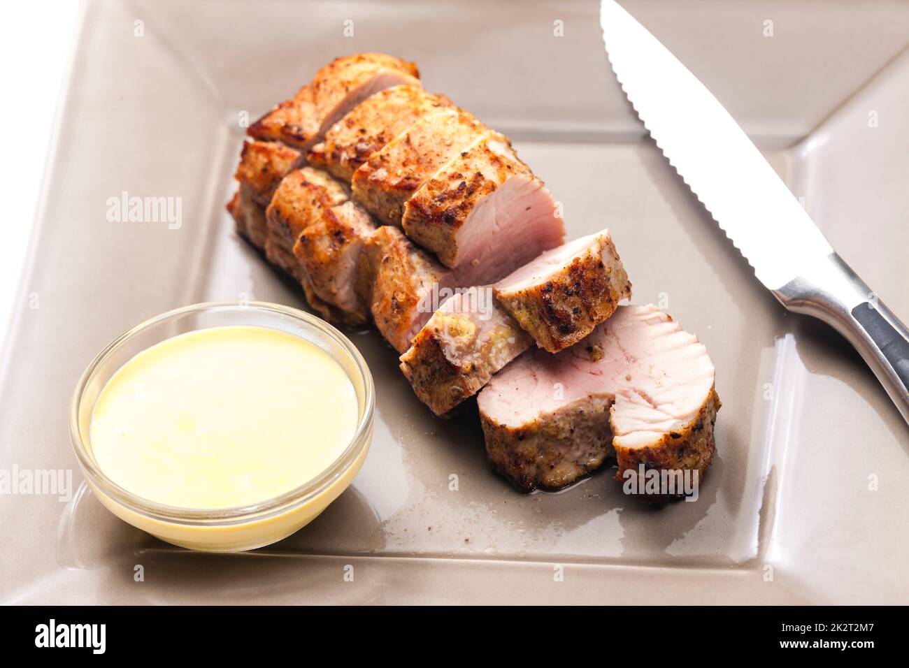 roasted pork loin with mustard sauce Stock Photo Alamy