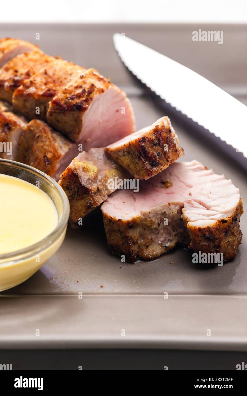 roasted pork loin with mustard sauce Stock Photo Alamy