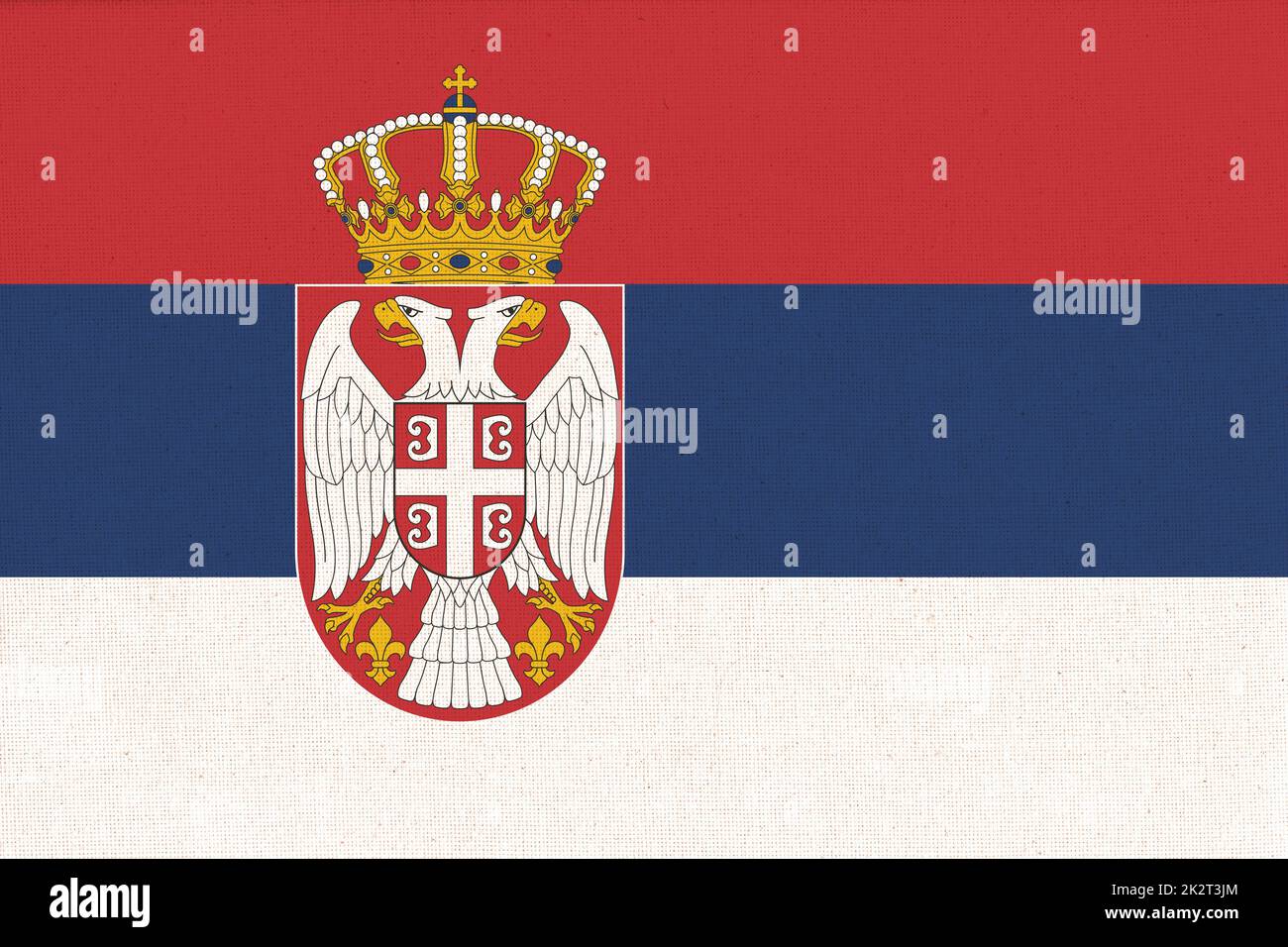 Flag of Serbia. Serbian flag on fabric texture. National Serbian symbol Stock Photo