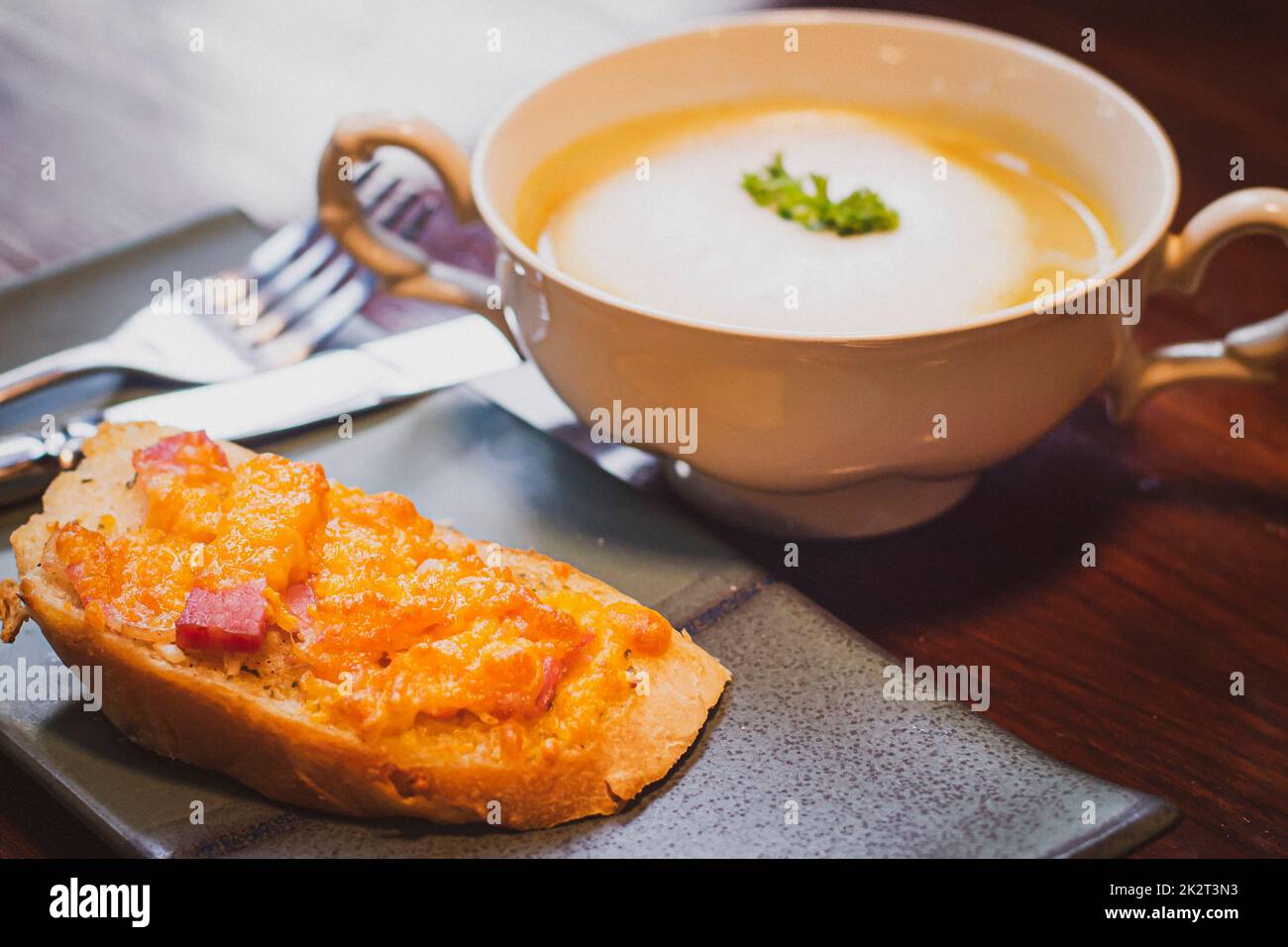 Mushroom Soup With Garlic Bread healthy beakfast in caramic blow and plate object still life. Stock Photo