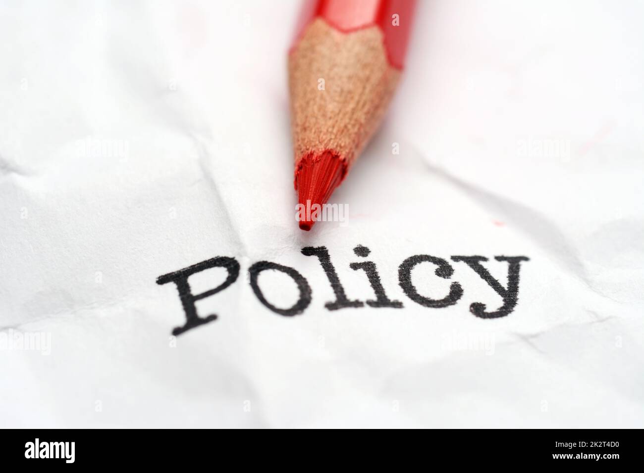 Pencil on policy text Stock Photo