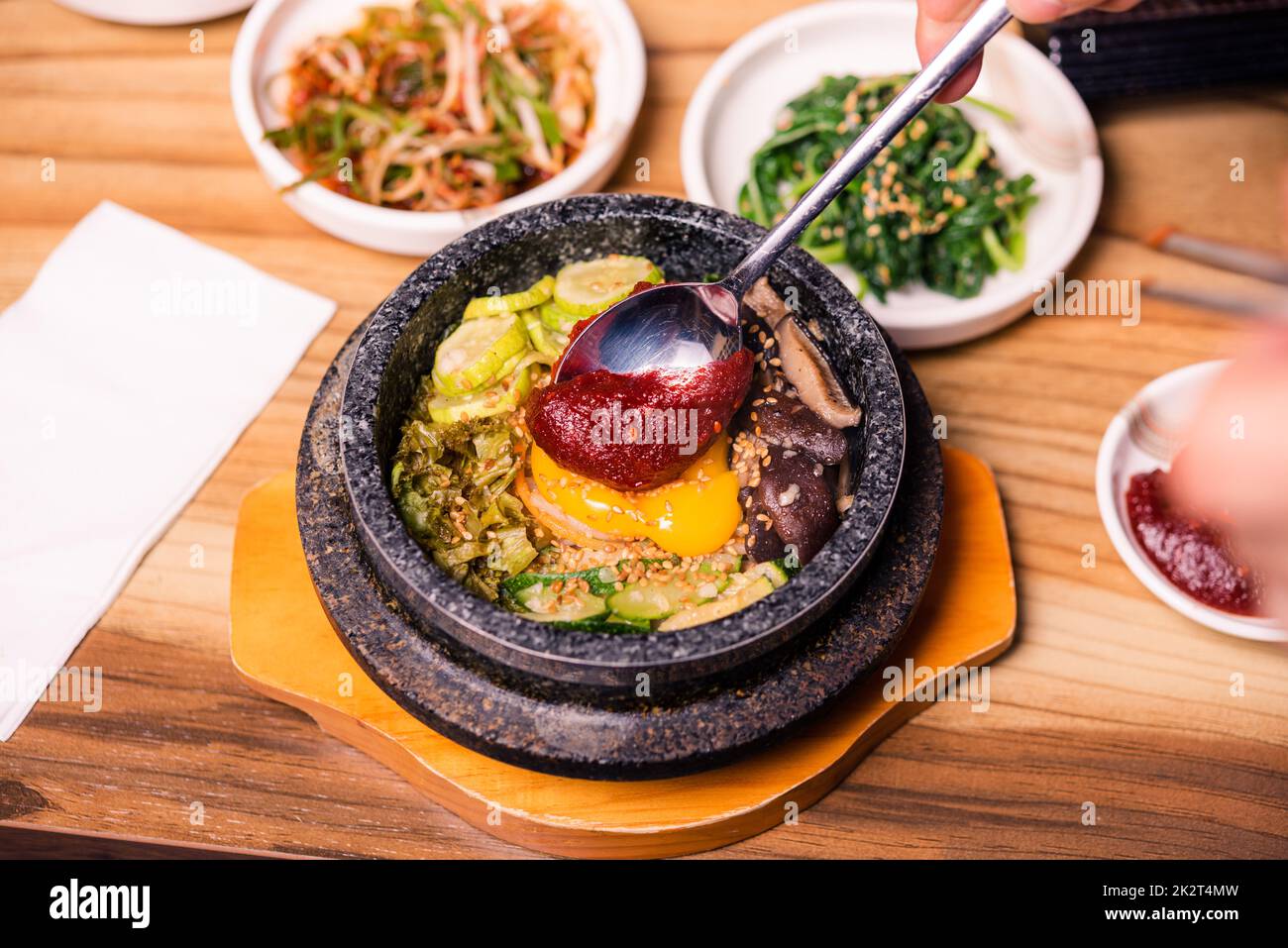 Korean traditional dish- bibimbap mixed rice with vegetables Include beef and fried egg Stock Photo