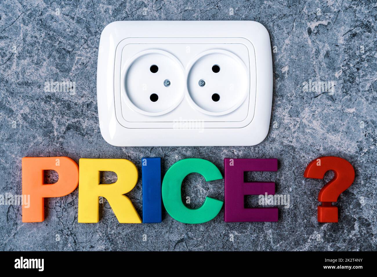 Double power European electric plug on the wall with a word PRICE Stock Photo