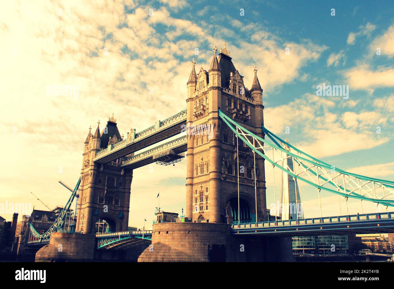 Tower Bridge in London, the UK. Sunset with beautiful clouds. Drawbridge opening. One of English symbols Stock Photo