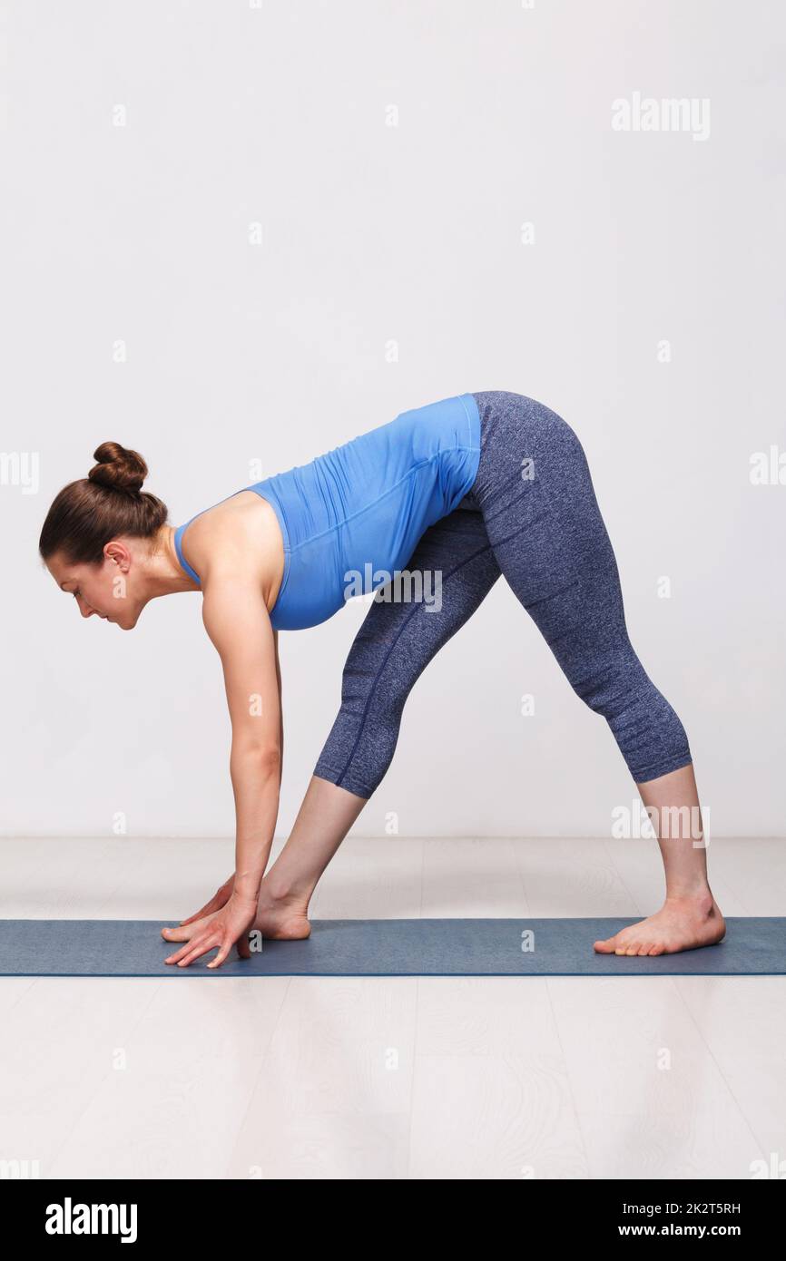 woman doing ashtanga vinyasa yoga asana parsvottanasana 2K2T5RH