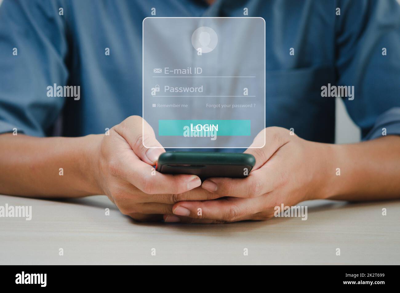 man using smartphone login password or email virtual screen concept technology. Stock Photo