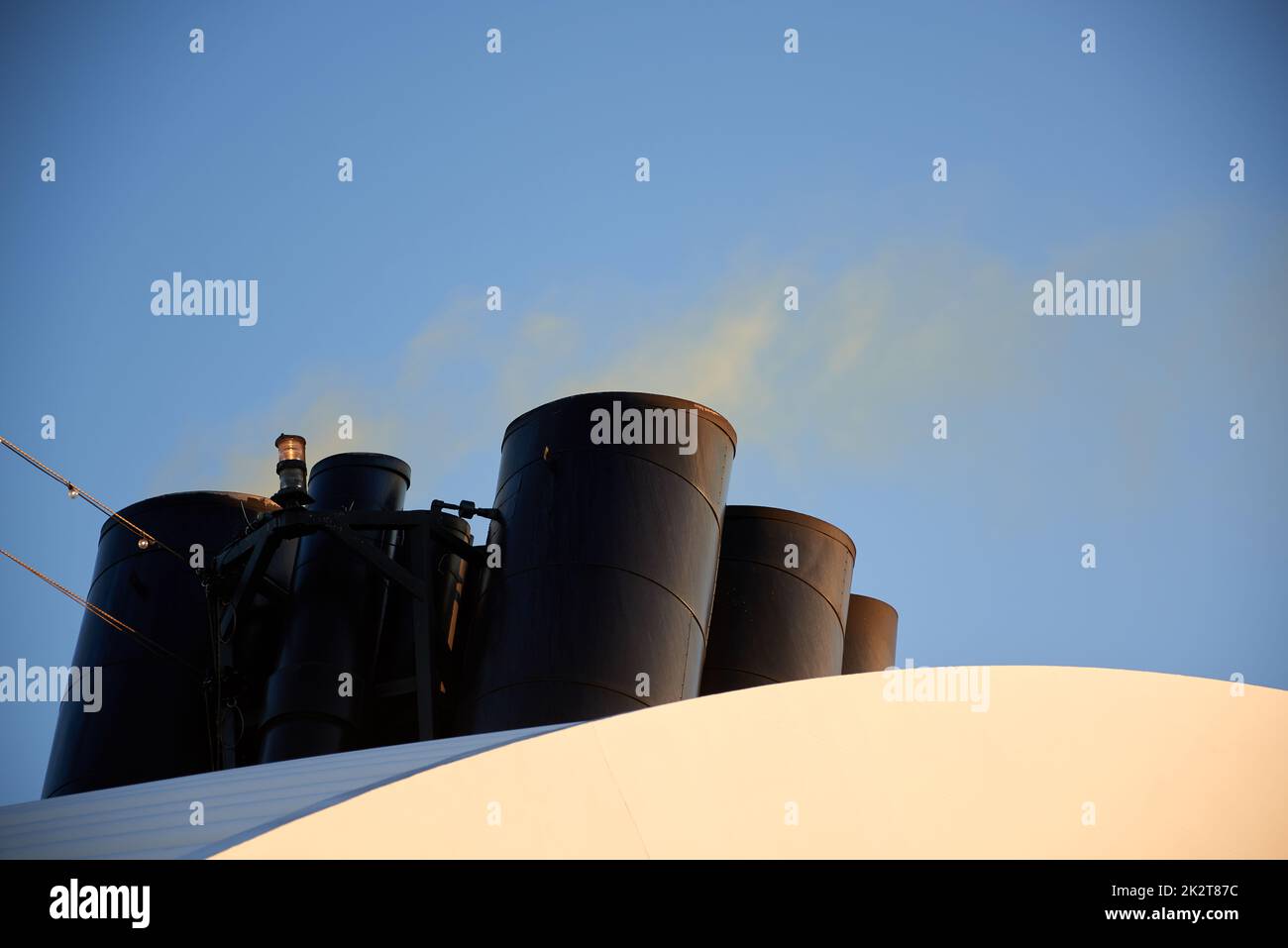 smoking chimney of an ordinary cruise ship Stock Photo