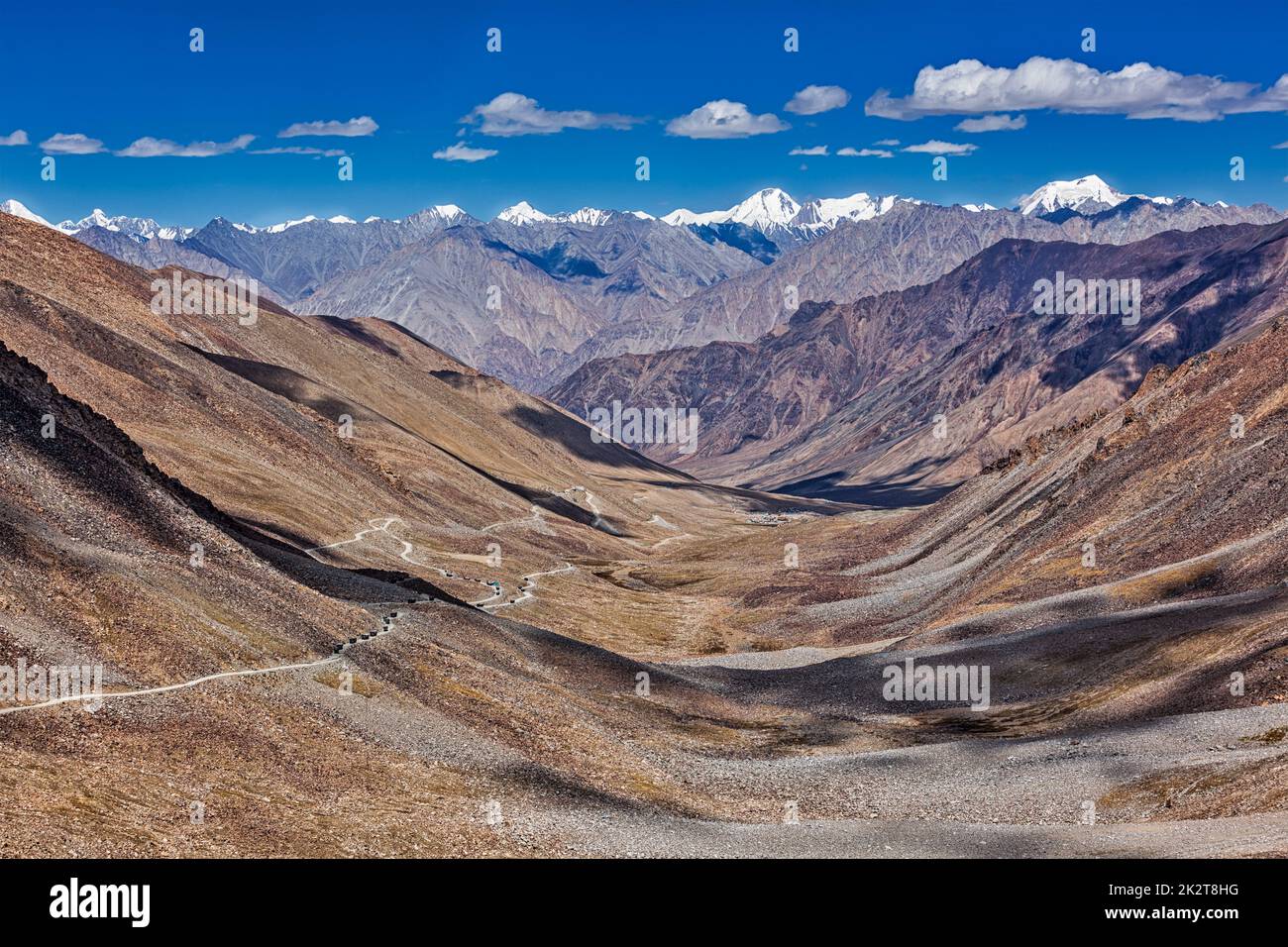 Karakorum Range and road in valley, Ladakh, India Stock Photo