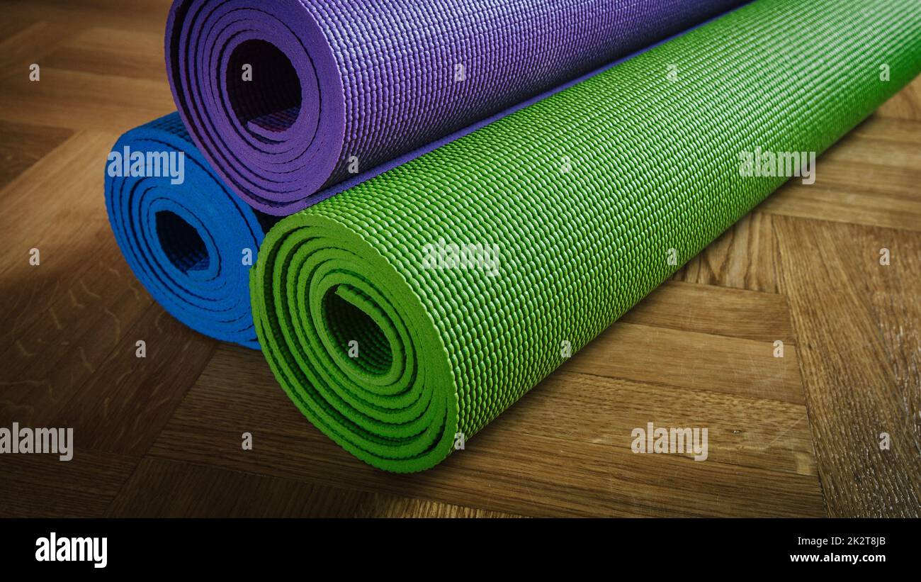 Yoga mats on floor Stock Photo