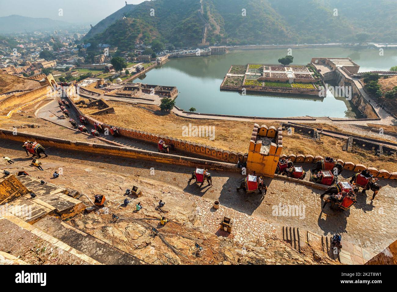 Tourists riding elephants on ascend to Amer fort Stock Photo