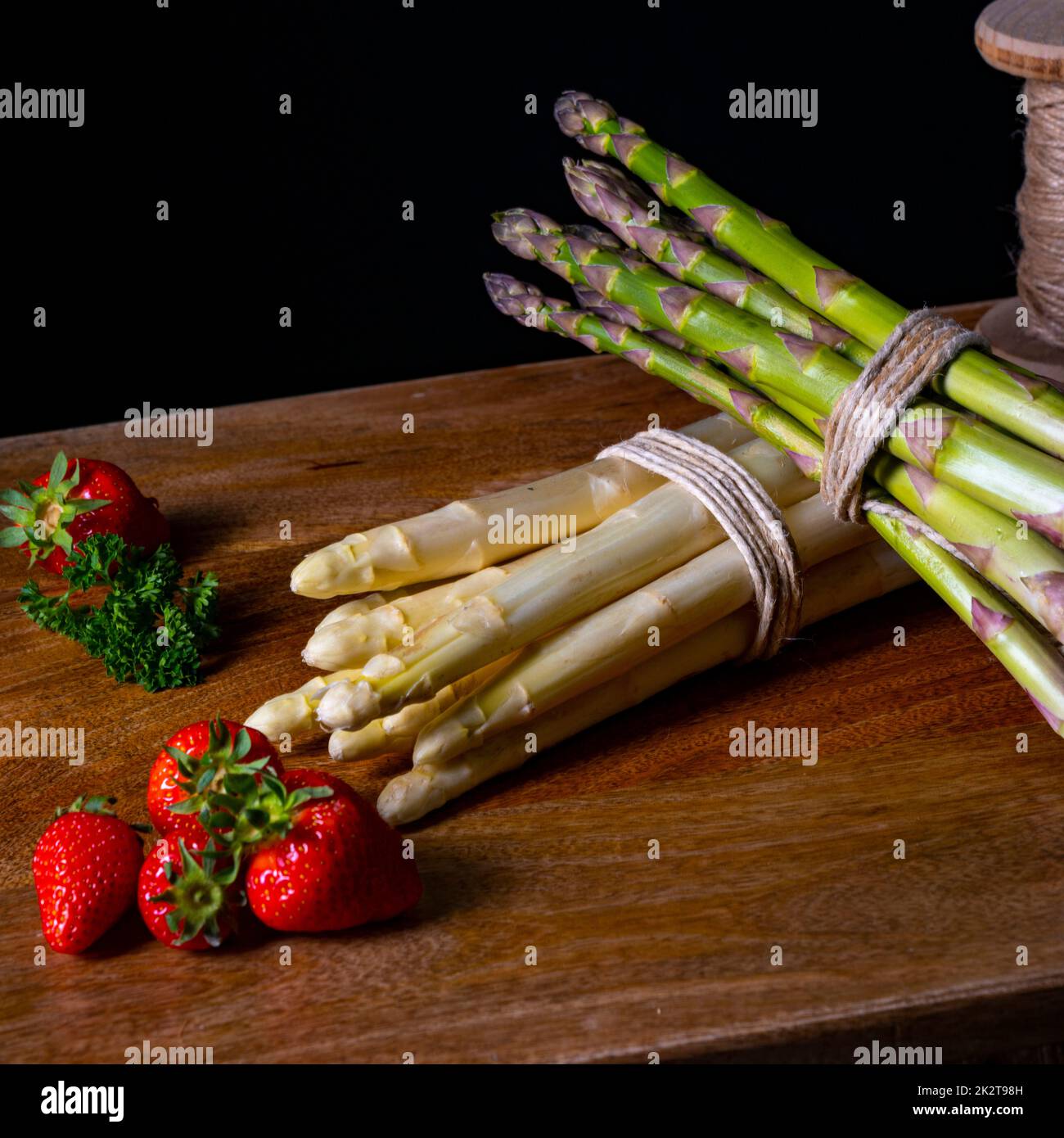 Green and white asparagus on the table Stock Photo