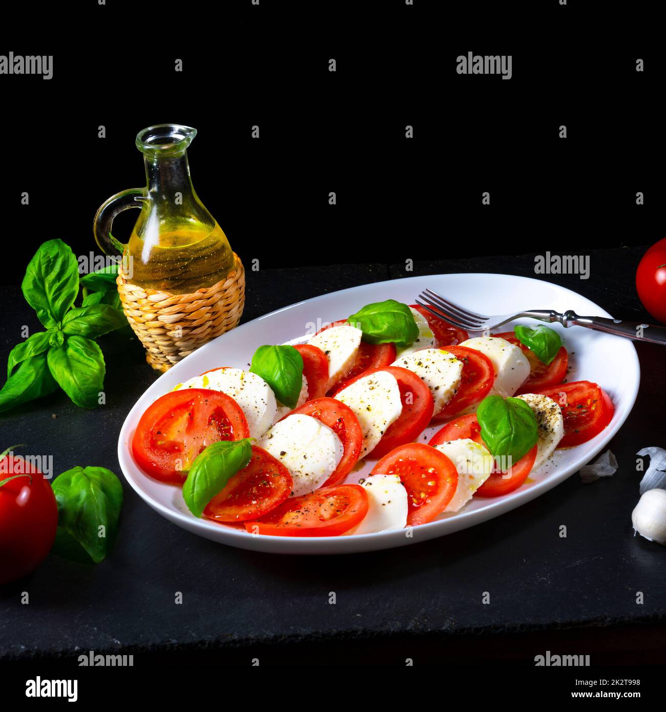 Tomato with mozzarella and basil Stock Photo