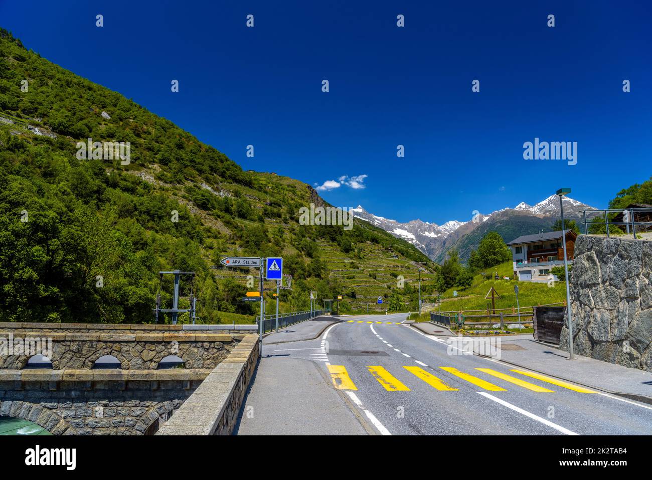 Asphalt road in Alps mountains, Stalden, Visp, Wallis, Valais, S Stock Photo