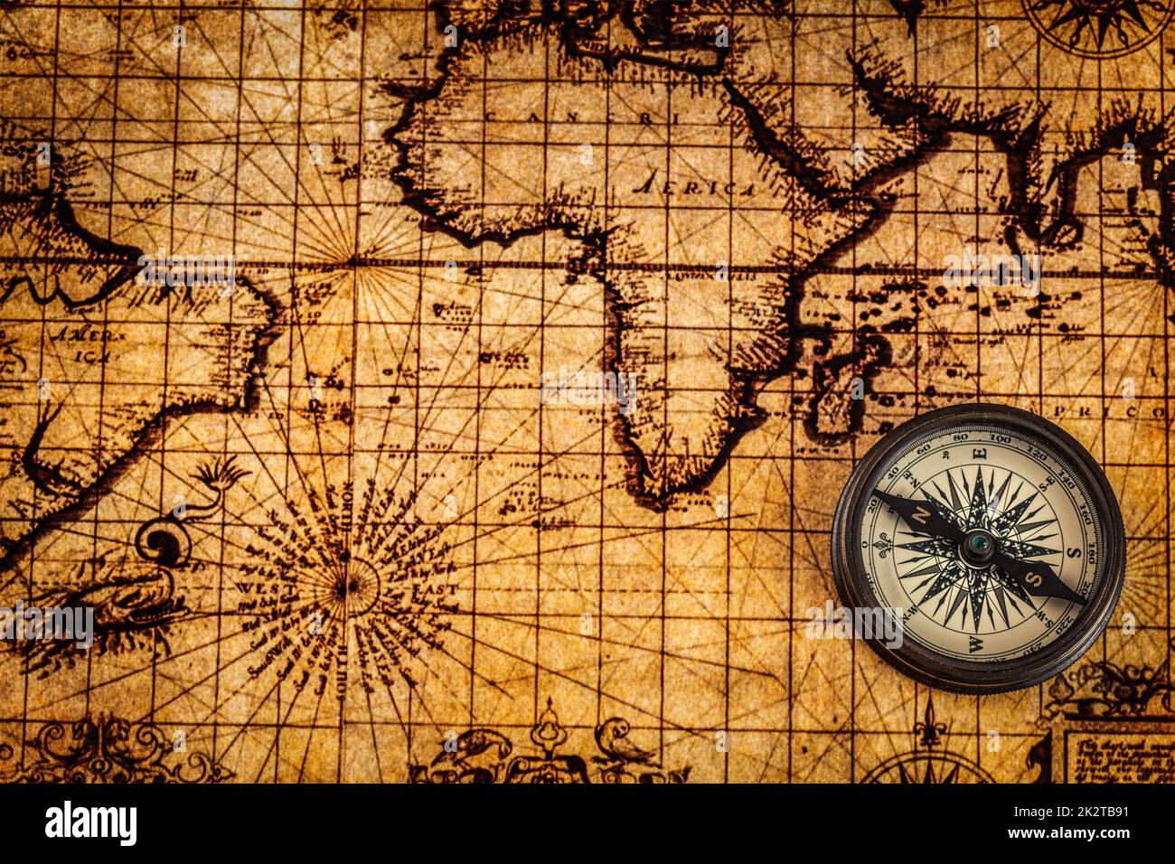 Old vintage compass on ancient map Stock Photo