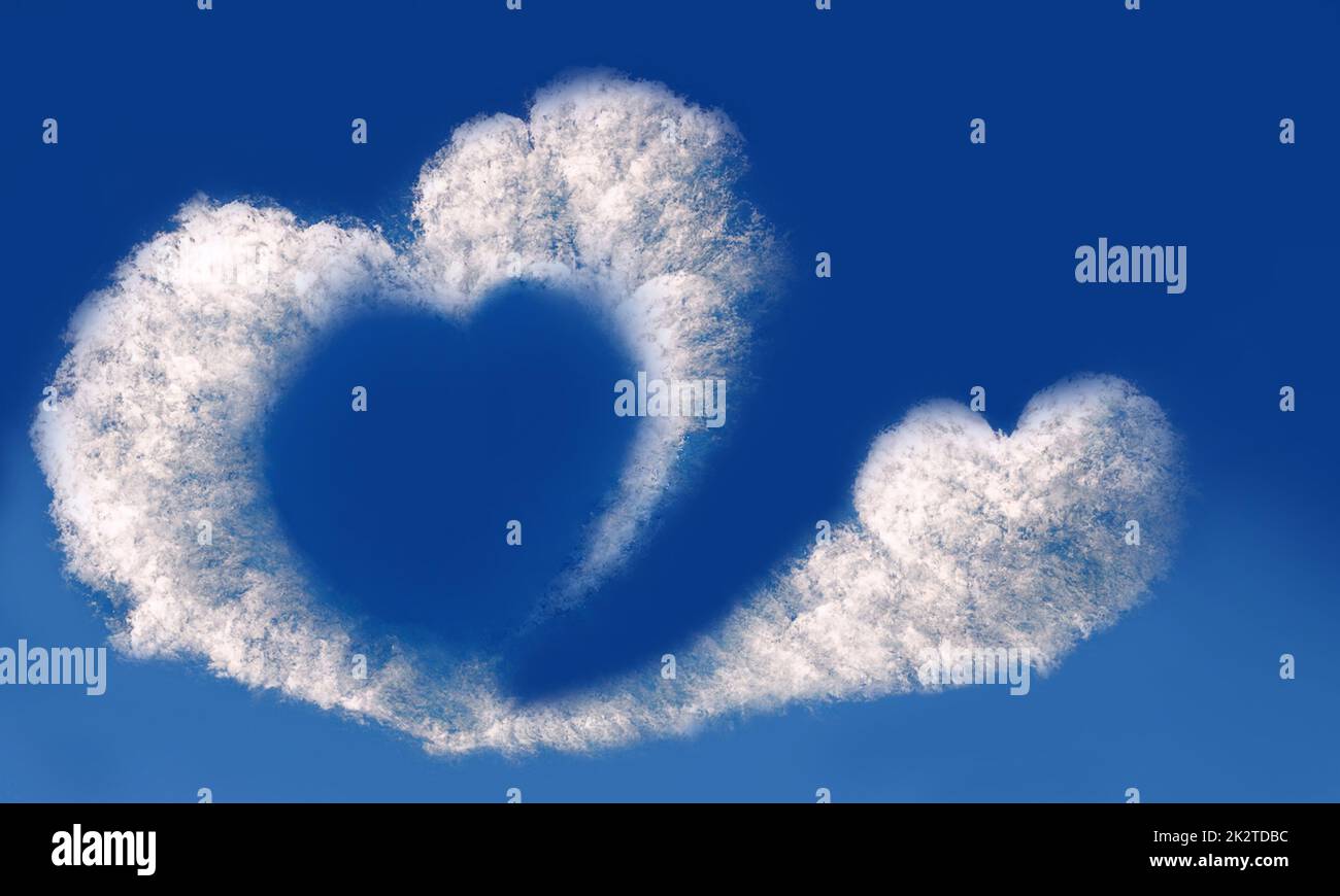 Heart shaped cloud on blue sky. Valentine day greeting card or wedding ...
