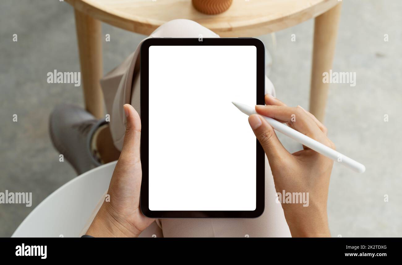 using stylus pen on digital tablet first person view Stock Photo