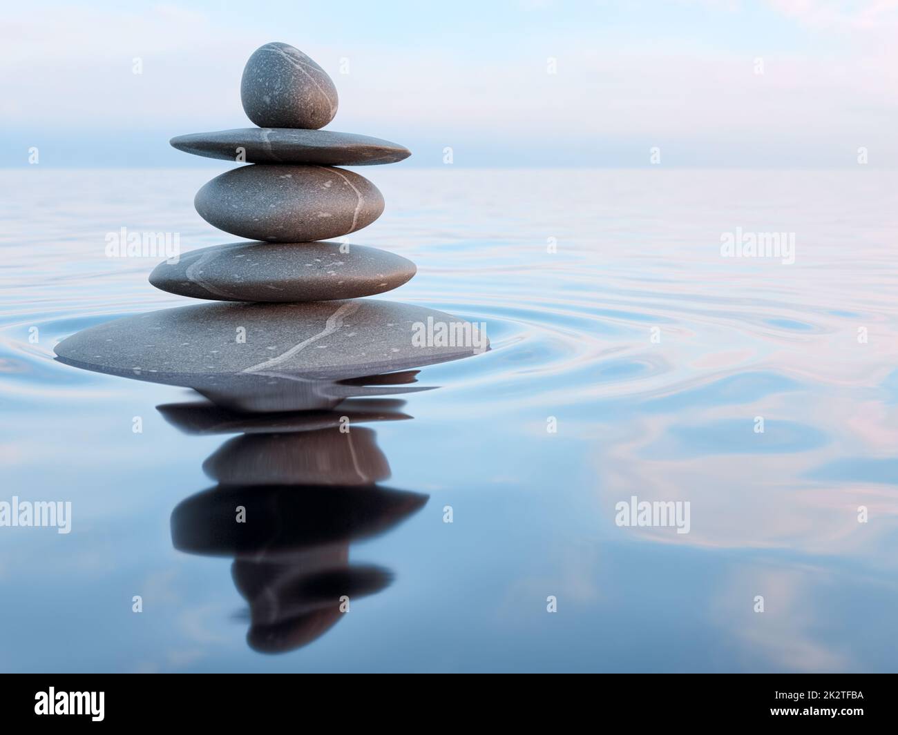 Balanced Zen stones in water Stock Photo Alamy