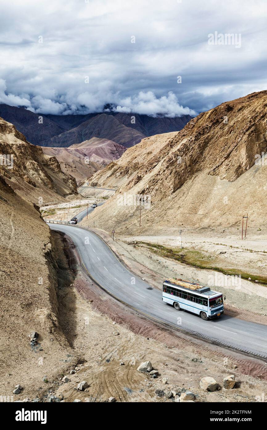 Indian passenger bus on highway in Himalayas. Ladakh, India Stock Photo