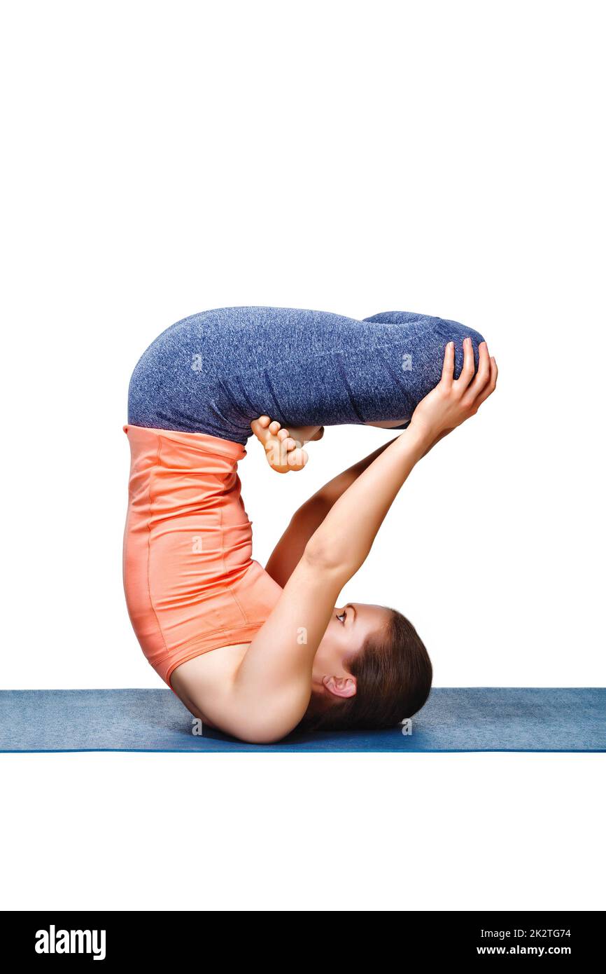Sporty fit yogini woman practices inverted yoga asana Stock Photo