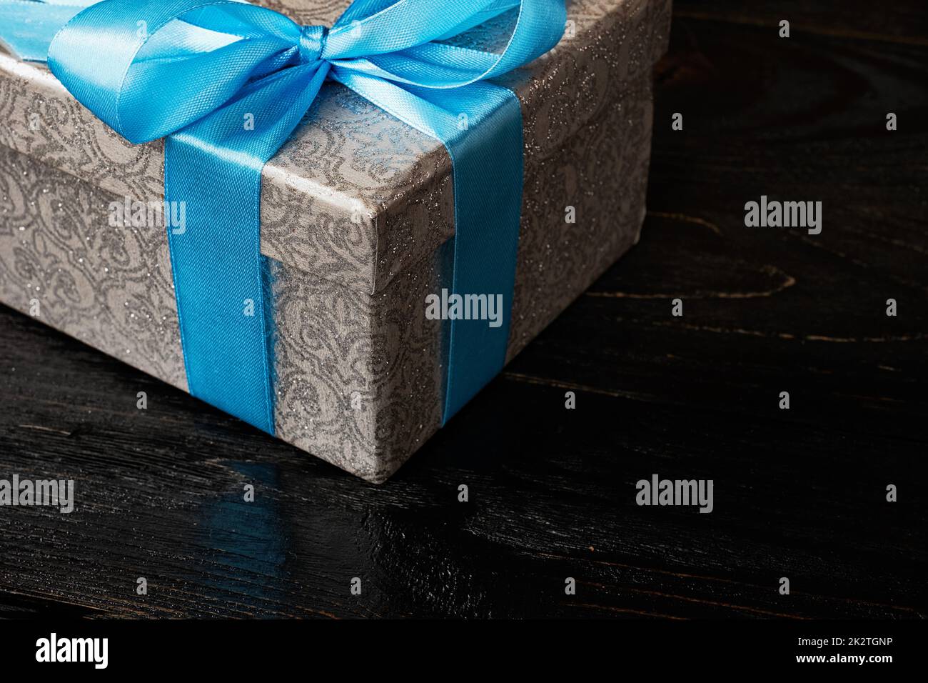 Gift box with red ribbon Stock Photo