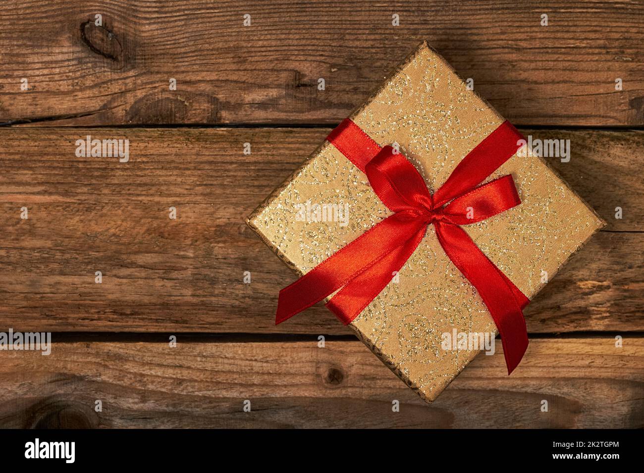 Gift box with red ribbon Stock Photo - Alamy
