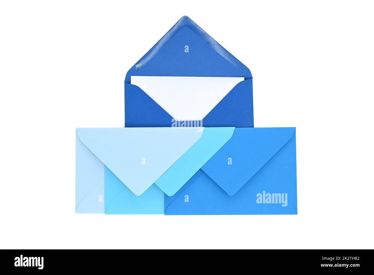 Envelopes of blue hues with blank white card Stock Photo