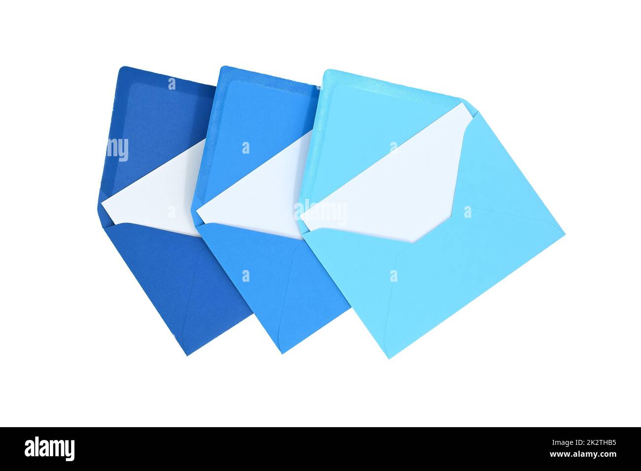 Envelopes of blue hues with blank white card Stock Photo