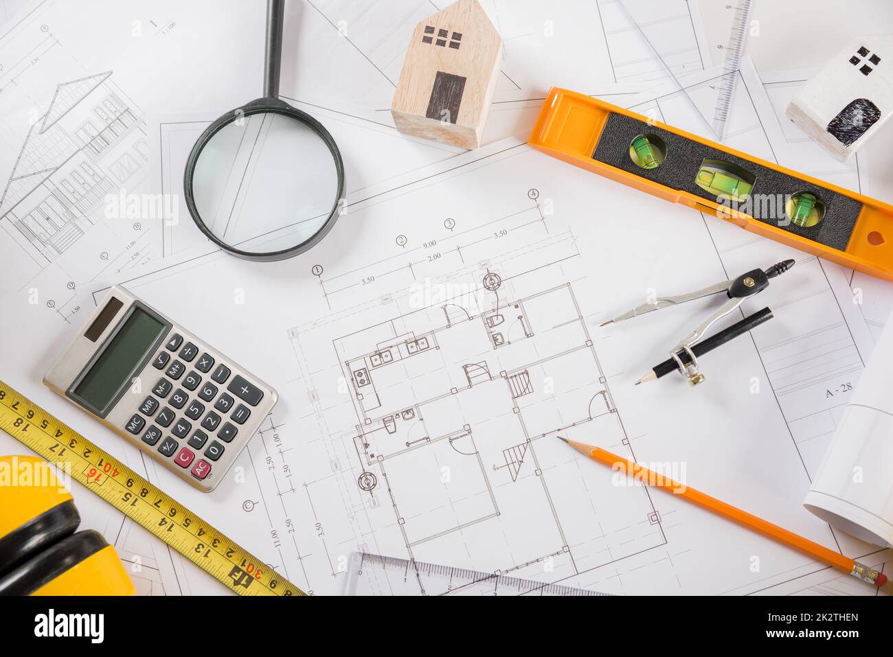 top-view-of-house-plan-blueprint-paper-with-repair-tools-on-table-desk